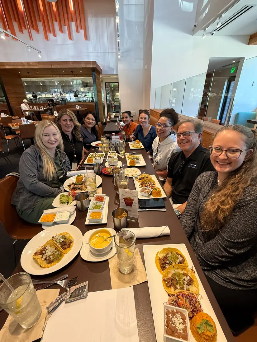 Accident Care team sharing their Monday strategy lunch